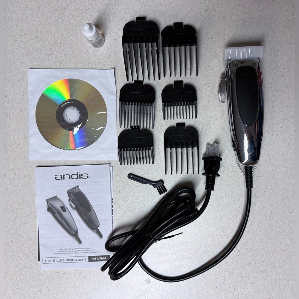 Andis Grooming Clippers with Attachments and CD.  Used Once!